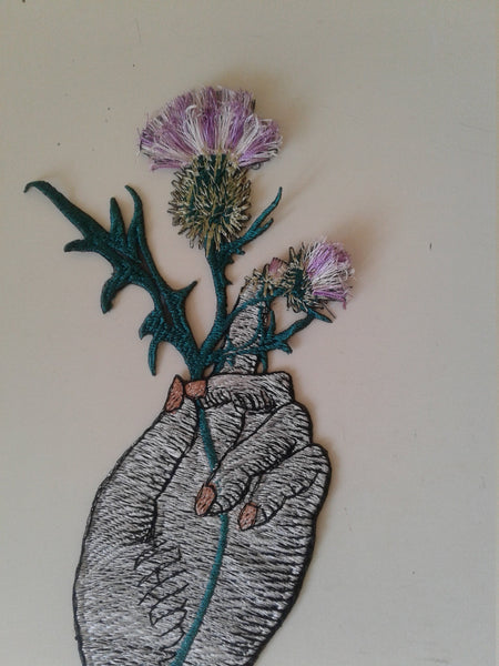 moks183(p) large hand with thistle flower - embroidered patch