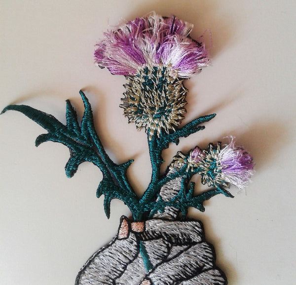 moks184(p) hand with thistle - embroidery patch